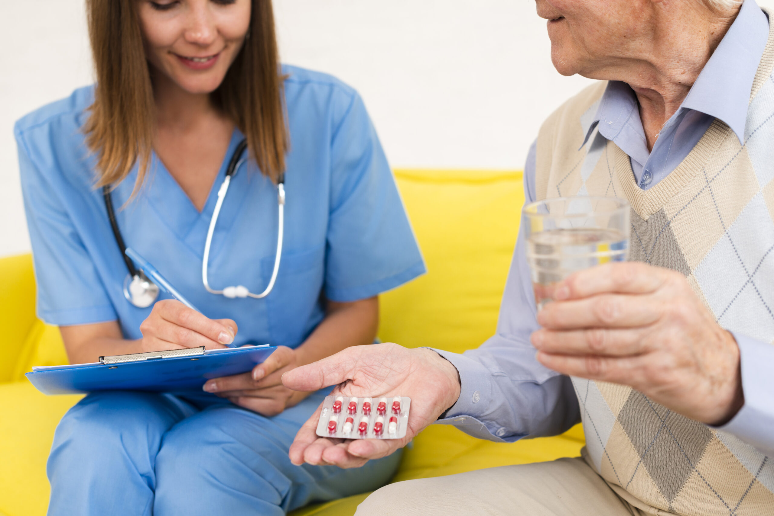 medium shot old man holding his pills scaled